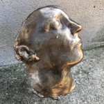 Bronze face sculpture